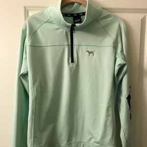 Pale green. Pink pullover.